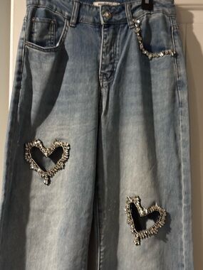 Light Wash Wide-Leg Jeans with Crystal Heart Embellishments.